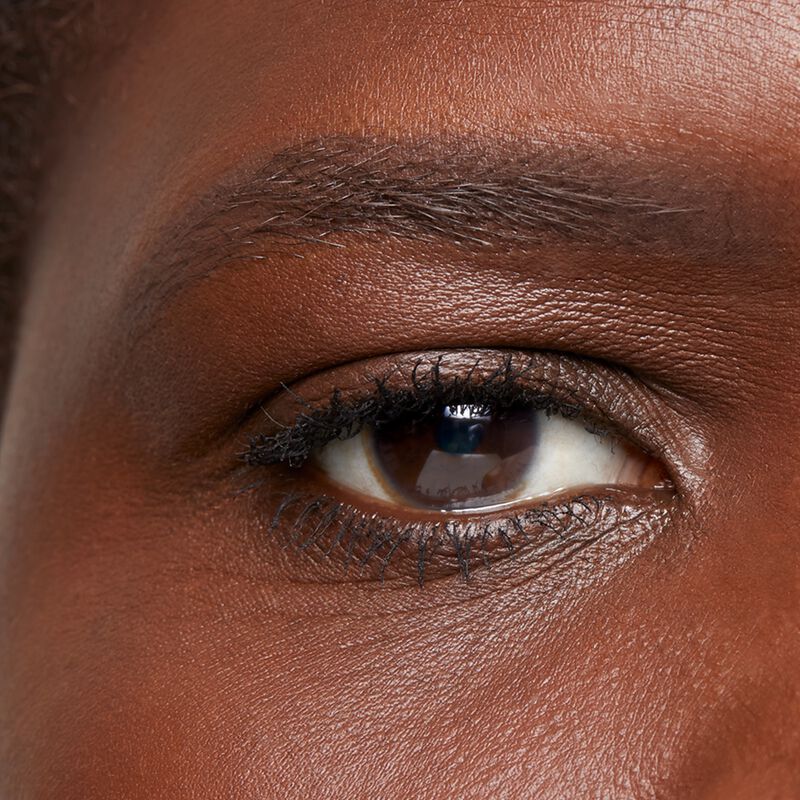 Close-up of deep-skinned model&rsquo;s eye area after using the limited-edition Mary Kay Brow Kit in Dark Brunette